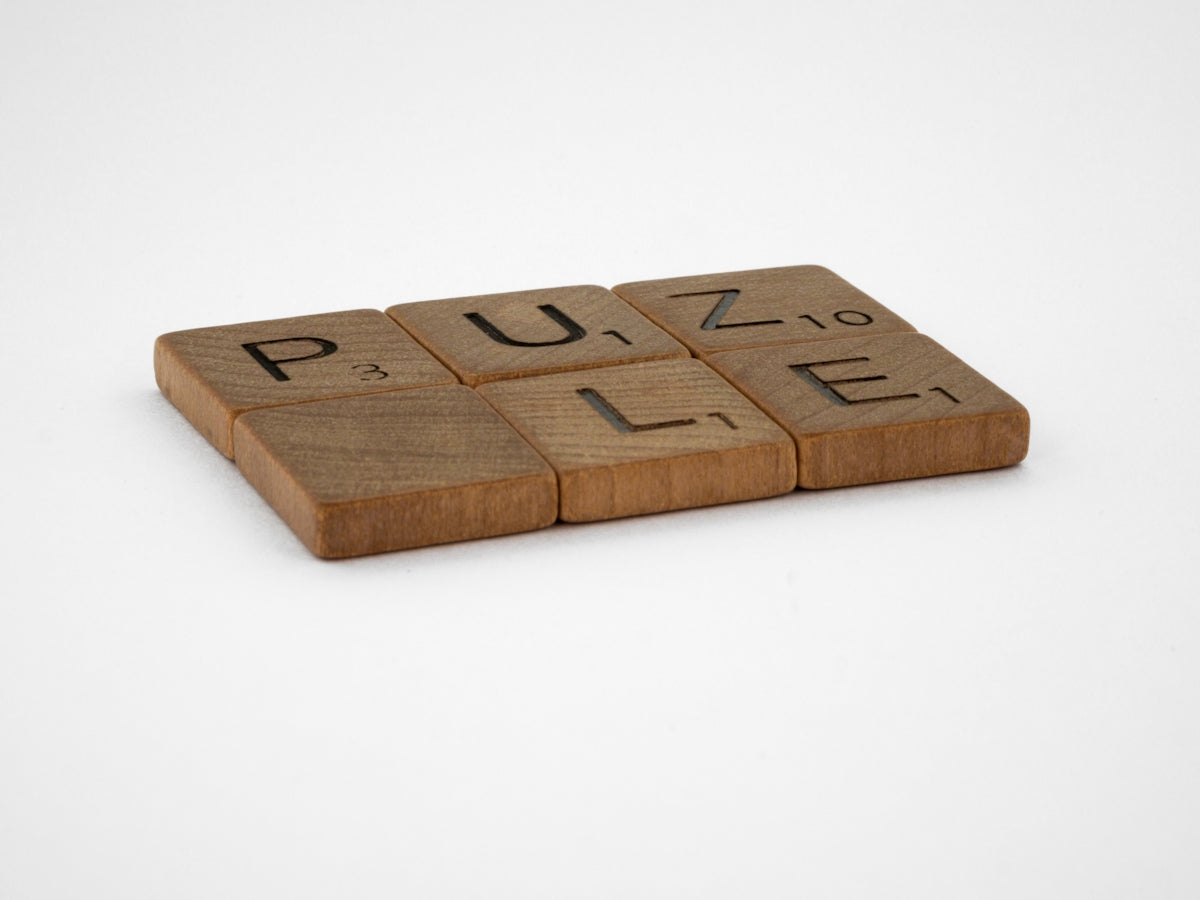 brown wooden letter i on white surface